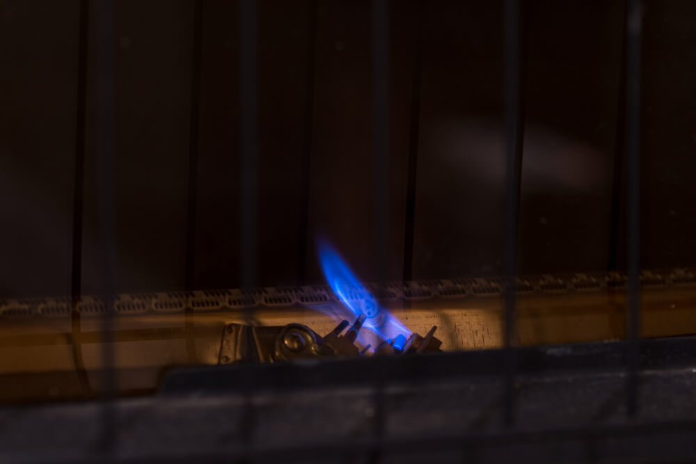 A close up of a furnace pilot light